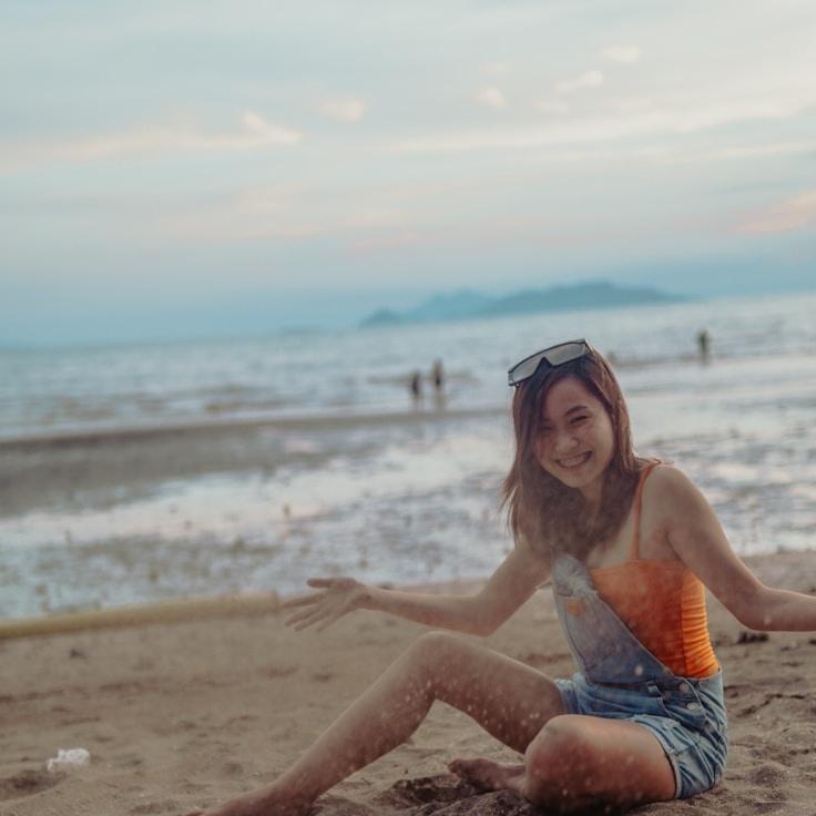 Amina Rao, Lead Design Curator at Cloud Grove Folio, reviewing corporate floral arrangements